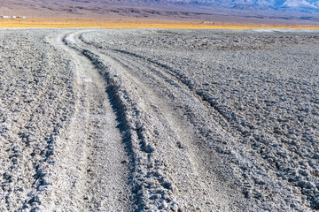 Tire tracks through the Alkali flats of dry Owens Lake near Keeler, California, USA