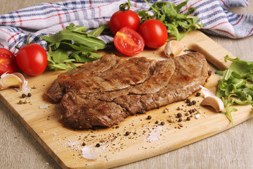 A beef steak well done with vegetables