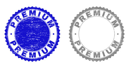 Grunge PREMIUM stamp seals isolated on a white background. Rosette seals with grunge texture in blue and gray colors. Vector rubber stamp imitation of PREMIUM text inside round rosette.