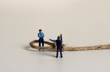 Miniature police and rope.