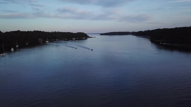 two boats sailing side by side