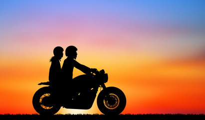 Fototapeta premium silhouette of lover couple in sunset with classic motorcycle