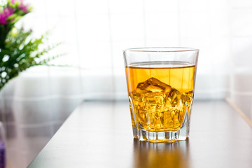 Glass of tea on the table background