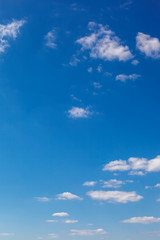 Naklejka na ściany i meble Blue sky with white clouds as a background