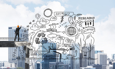 Businessman drawing ecological conceptual sketches