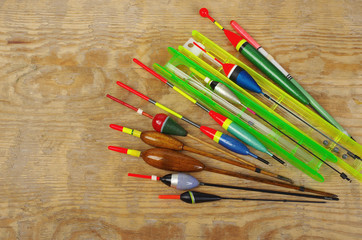 Fishing floats and fishing gear on a wooden table © yrafoto