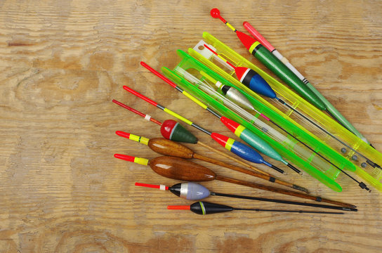 Fishing floats and fishing gear on a wooden table