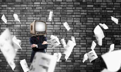 Businessman with old TV instead of head.