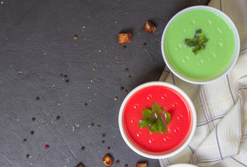 Variety of colorful vegetables cream soups and ingredients for soup. Top view. Concept of healthy eating or vegetarian food