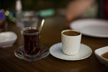 Turkish coffee and tea are together. Oriental glass Cup with tea, Cup with Oriental coffee. 