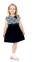 Little girl in an elegant dress.