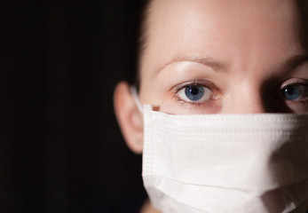 portrait of a young woman in medical mask