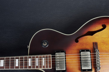 Jazz guitar on a dark background. Close-up
