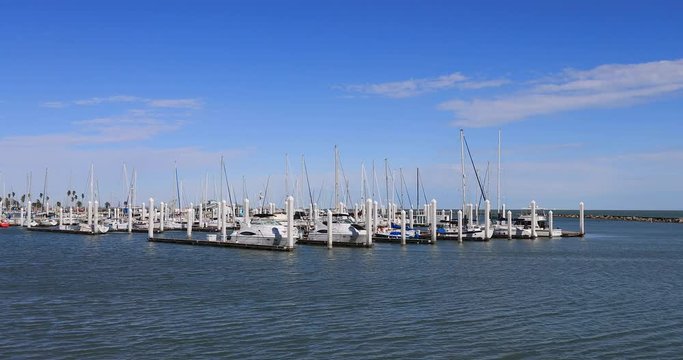 Corpus Christi Texas Marina harbor sailboats. South Texas tourism travel destination. Waterfront marina, port harbor and scenic byway.  Humid subtropical climate makes a year round vacation city. 