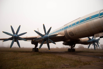  propellers of an old passenger plane in a hazy haze with blue frayed blades