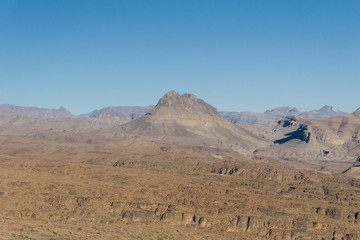 Morocco tourism: trekking man in mountains. Atlas mountains, Jebel Sakhro (Djebel Sahro), Ourzazate, Morocco