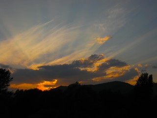 Beautiful sunset on the river with mountains