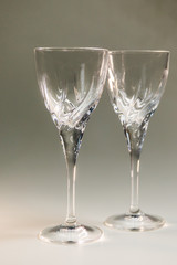 Two beautiful crystal glasses on a thin stem for wine.