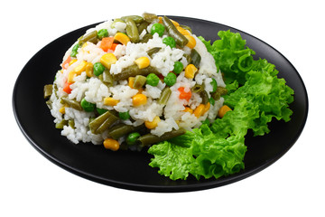 black plate with white rice, green peas, canned corn kernels, cut green beans isolated on white background