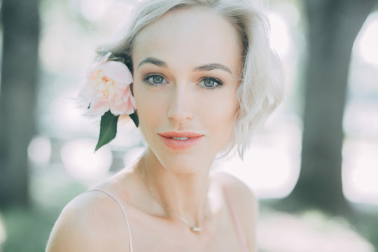 portrait of young woman with flower