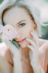 portrait of young woman with flower