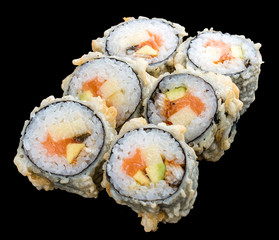 Roll tempura with salmon and vegetables on black background