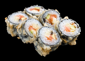 Roll tempura with salmon and vegetables on black background