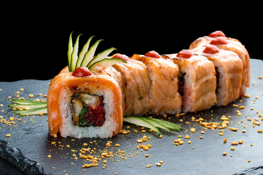 Sushi roll red Dragon on black background