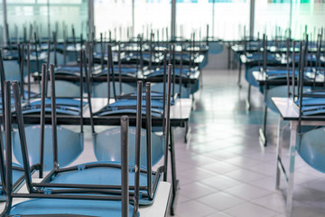 chair on the table in the closed canteen