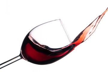 Wine splashing out of glass