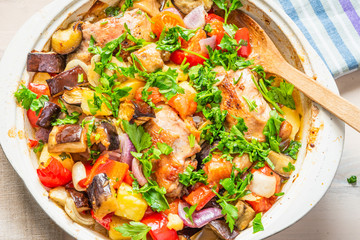Homemade chicken stew with vegetables in a large pot - healthy organic food.