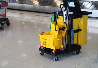 Closeup of janitorial, cleaning equipment and tools for floor cleaning at the airport. 