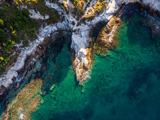 Aerial view of a cliffs and turquoise waters in Greece