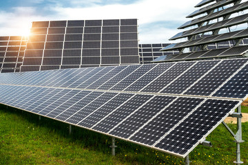 Solar panels, photovoltaics, with sun tracking systems -  alternative electricity source, concept of sustainable resources