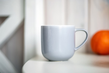 Gray mug on kitchen table