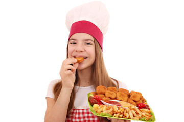 girl cook eats chicken nuggets and french fries