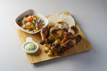 roasted whole chicken rice inside with mexican salad pita and avocado dip