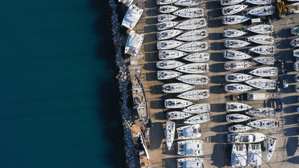 Aerial drone top view photo of mediterranean shipyard and port with yachts and sailboats by the sea