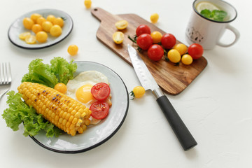 cherry tomatoes, eggs, corn and vegetablesv