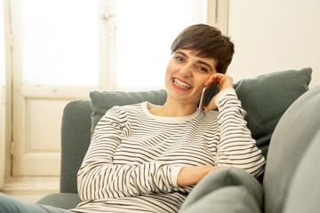 Obraz premium Portrait of young beautiful woman talking flirting and chatting on her smart phone