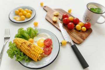 cherry tomatoes, eggs, corn and vegetablesv