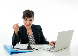 Portrait of happy attractive young businesswoman working on her laptop looking confident