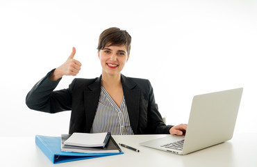 Portrait of happy attractive young businesswoman on laptop looking confident with thumb up