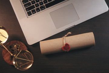 justice and law concept. Lawyer workplace with laptop and documents with dark wooden. Notary's...