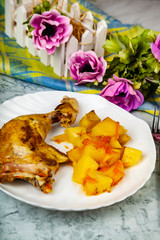 Fried chicken legs with potatoes