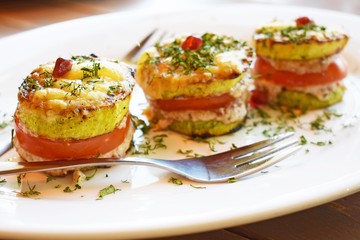 Vegetarian appetizer of fried vegetables with sauce close-up vertically.