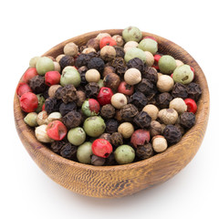 Pepper mix seed on spoon on white background.