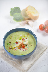 bowl of broccoli cream soup, croutons with olive oil, vegetarian soup