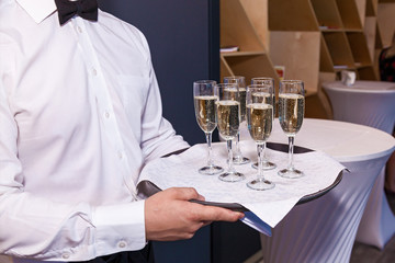 waiter pouring champagne