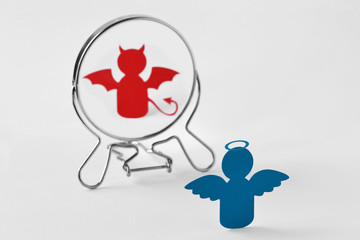 Angel looking in the mirror and seeing himself as a devil - Good and evil, distorted self-image...